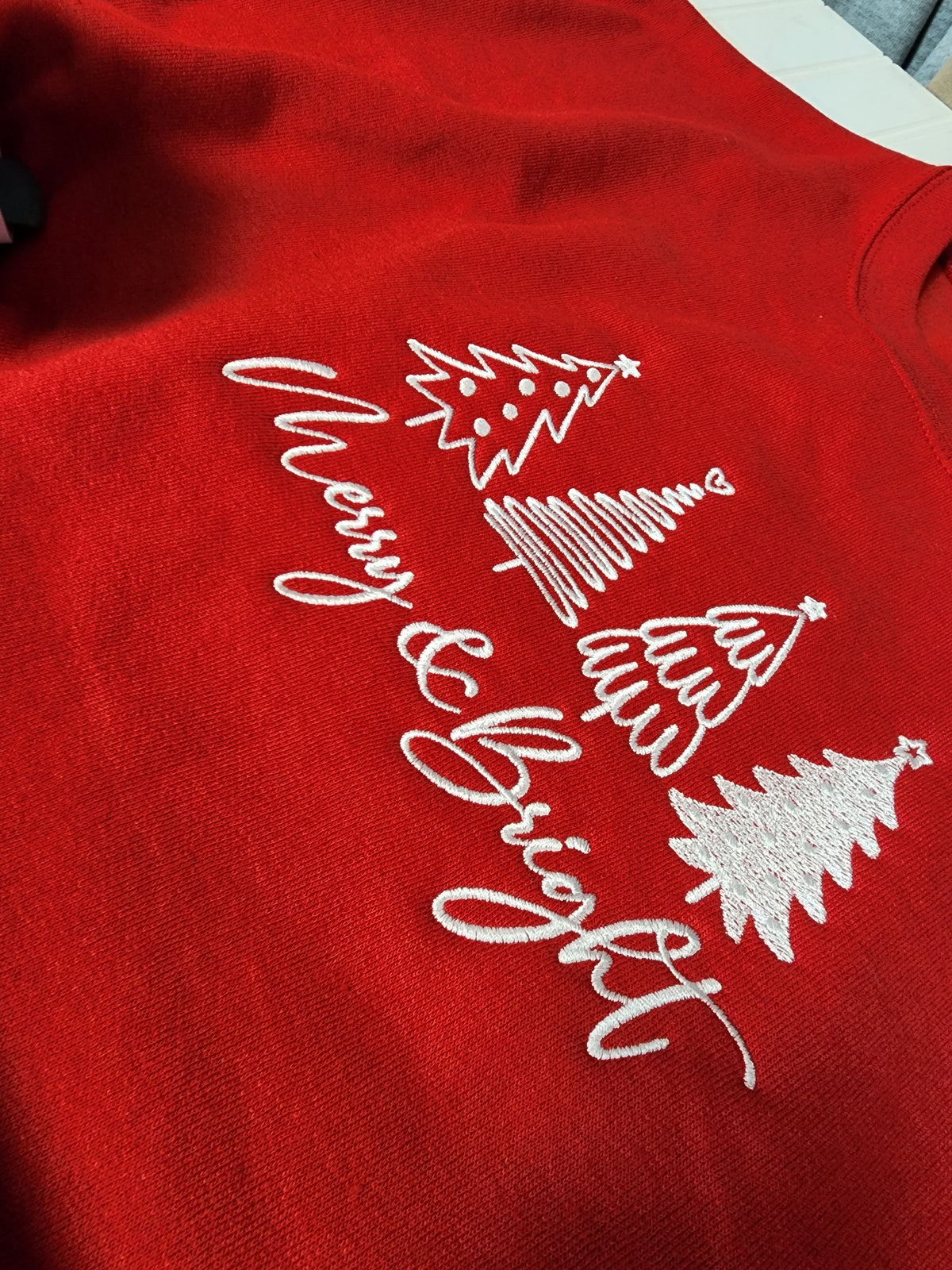 Merry & Bright Embroidered crewneck.